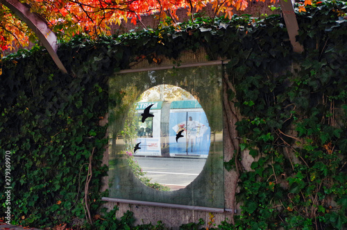 Parc del Centre de Poblenou, en Barcelona, con tranvía circulando al fondo photo