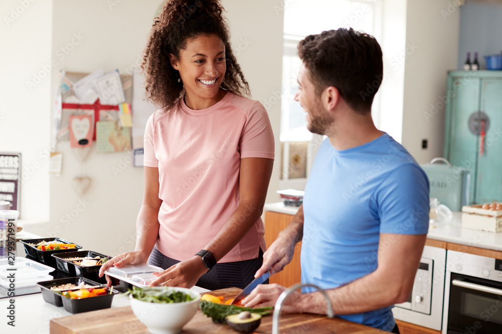 Couple Preparing Batch Of Healthy Meals At Home In Kitchen Together Couple Preparing Batch Of Healthy Meals At Home In Kitchen Together
