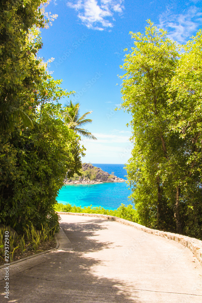 Road to the turquoise ocean and beach in Seychelles