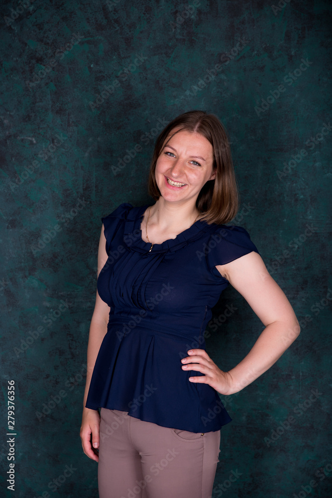 Fototapeta premium Portrait of Beautiful Young Woman in Studio
