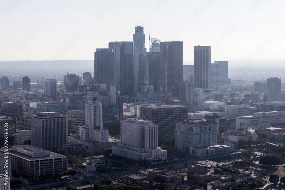 Smoggy afternoon aerial of buildings and streets in downtown Los Angeles, California.  