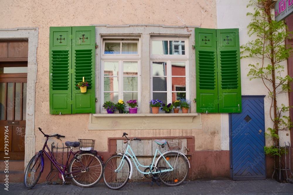 Bicycles under a pretty window in Heidelberg Germany