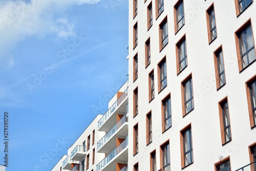 Multistory new modern apartment building. Stylish living block of flats.