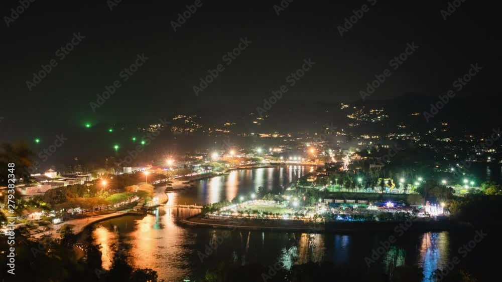 Chaweng town, Samui island, Thailand in night time, public park and city light between valley and sea, 4K timeslapse Chaweng town, Samui island, Thailand in night time, public park and city light between valley and sea, 4K timeslapse