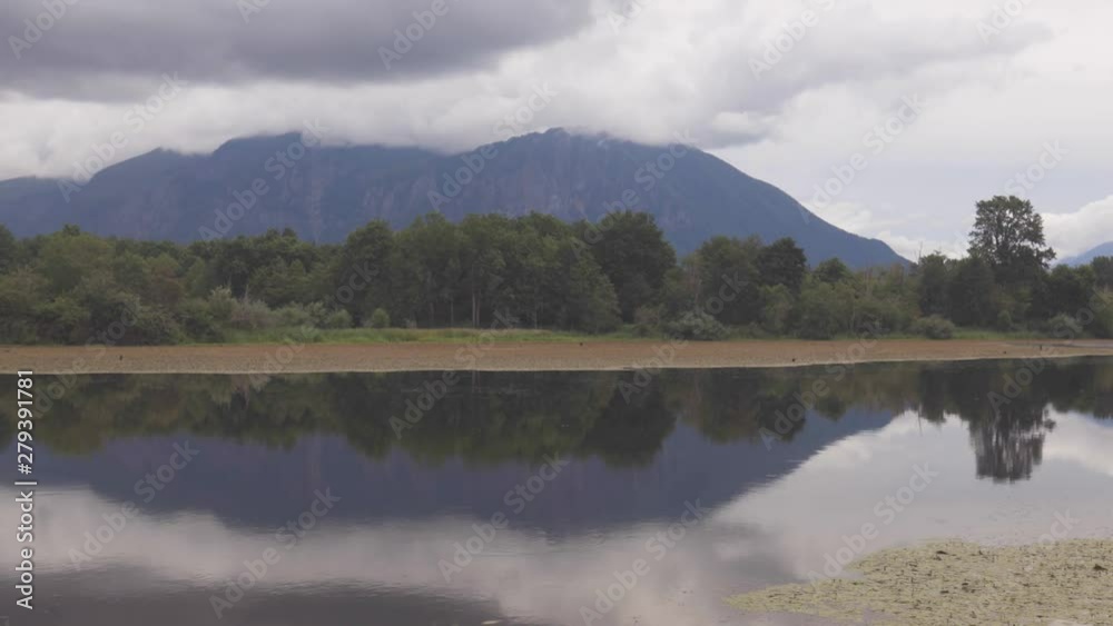 Cloudy Mountain Forest Timelapse Reflecting in Water - Snoqualmie Washington Mill Pond Cloudy Mountain Forest Timelapse Reflecting in Water - Snoqualmie Washington Mill Pond