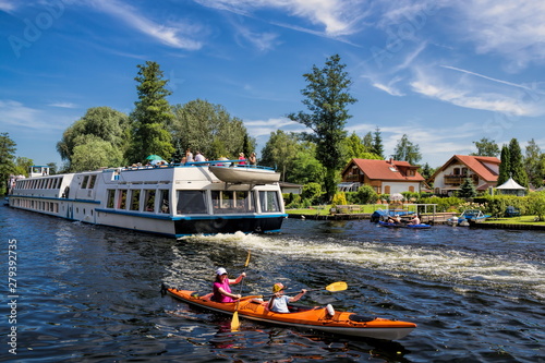 idylle mit booten auf der müggelspree in berlin köpenick, deutschland photo