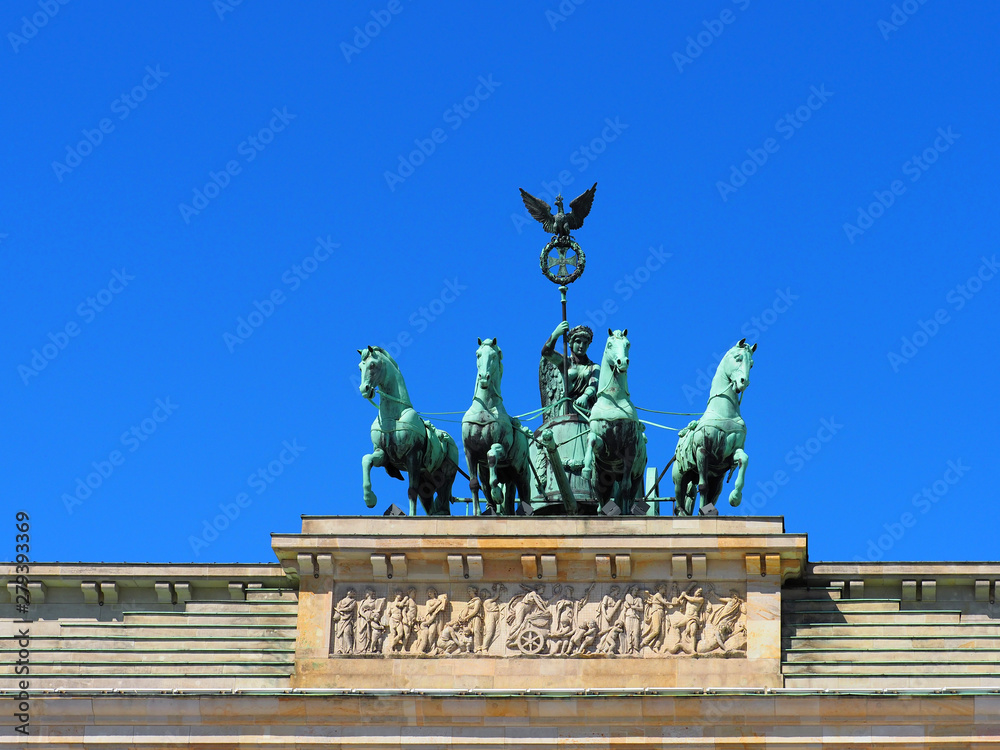 Quadriga on top of the Brandenburger Tor or Brandenburg Gate, Berlin, Germany. Blue sky