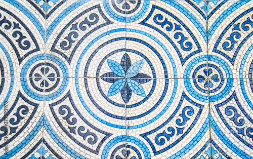 Old mosaic ornament in white and blue colors