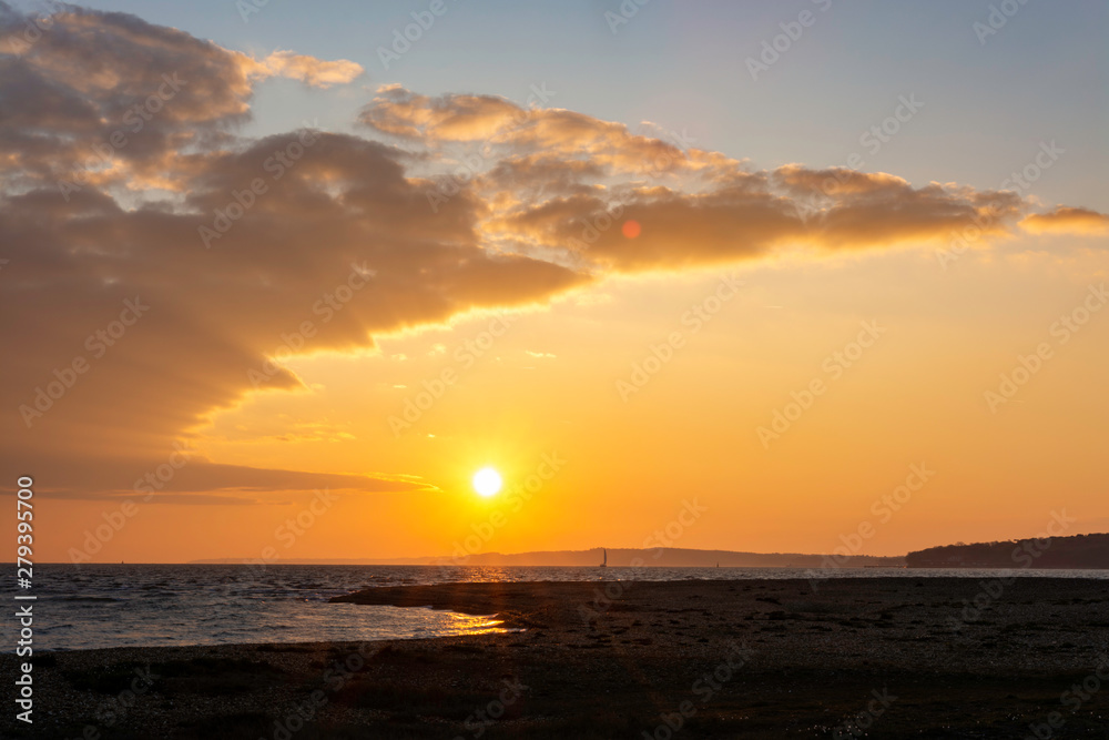 Sunrise in the coast with sailor boat Sunrise in the coast with sailor boat