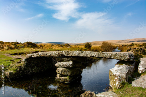 Stone footbridge over a stream in Dartmoor national park, England