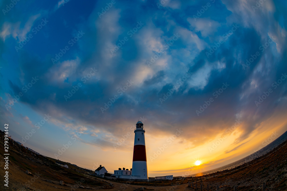 Portland Bill Lighthouse in fish eye super wide angle view during sunrise