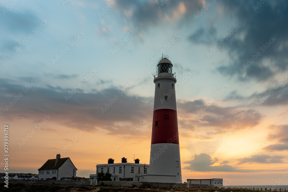 Portland Bill Lighthouse in Isle of Portland during sunrise with nicely moved clouds by a long exposed composition