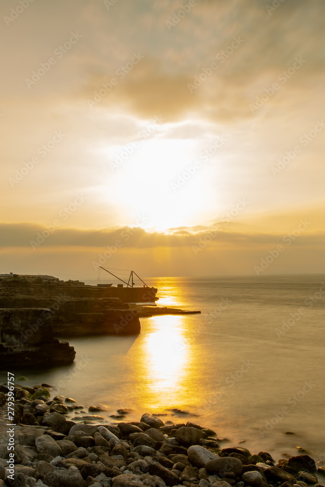 Fototapeta premium Sunrise in Isle of Portland in south of England in a long exposed photo
