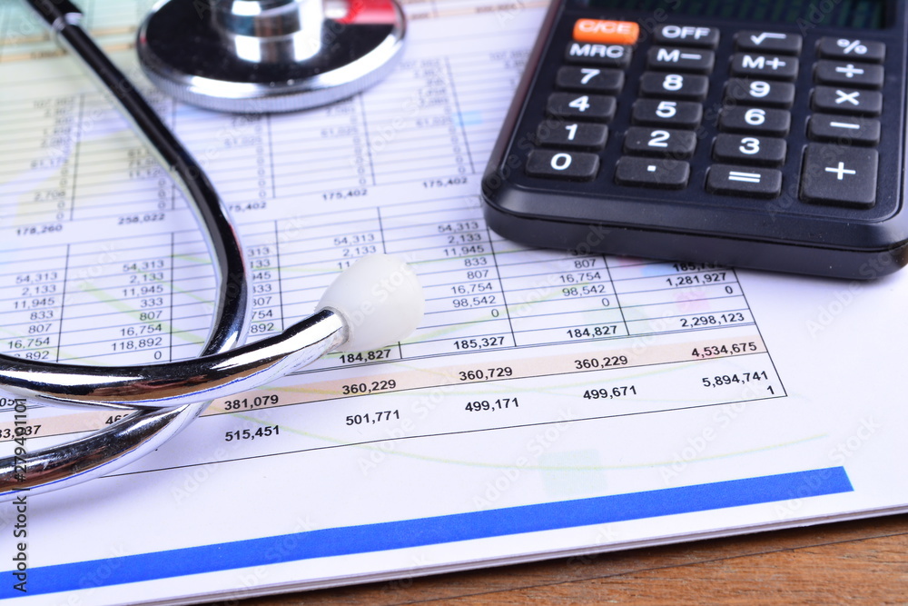 Health care costs. Stethoscope and calculator symbol for health care costs or medical insurance Health care costs. Stethoscope and calculator symbol for health care costs or medical insurance