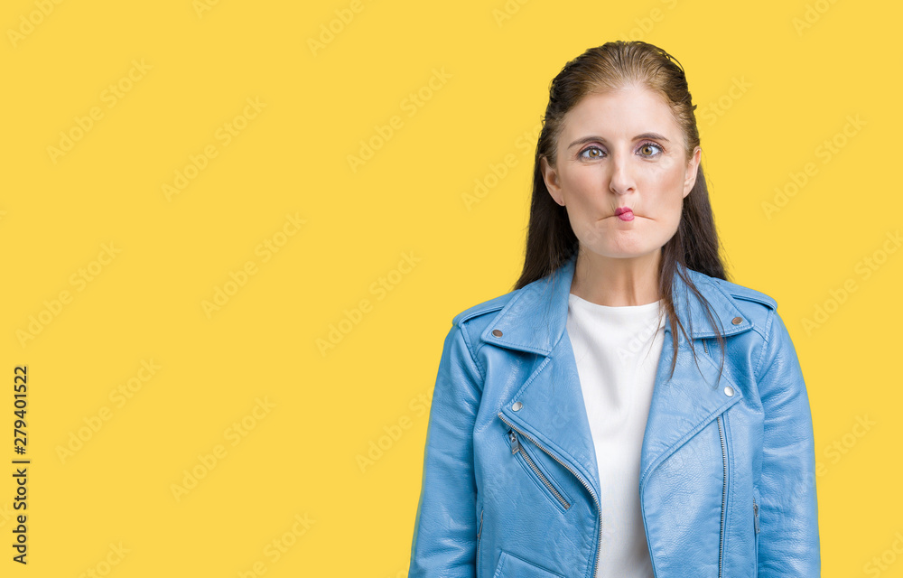 Beautiful middle age mature woman wearing fashion leather jacket over isolated background making fish face with lips, crazy and comical gesture. Funny expression. Beautiful middle age mature woman wearing fashion leather jacket over isolated background making fish face with lips, crazy and comical gesture. Funny expression.