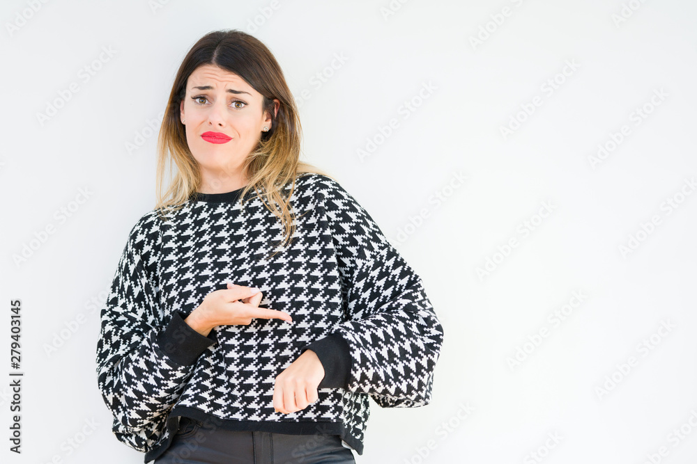 Young woman wearing casual sweater over isolated background In hurry pointing to watch time, impatience, upset and angry for deadline delay Young woman wearing casual sweater over isolated background In hurry pointing to watch time, impatience, upset and angry for deadline delay
