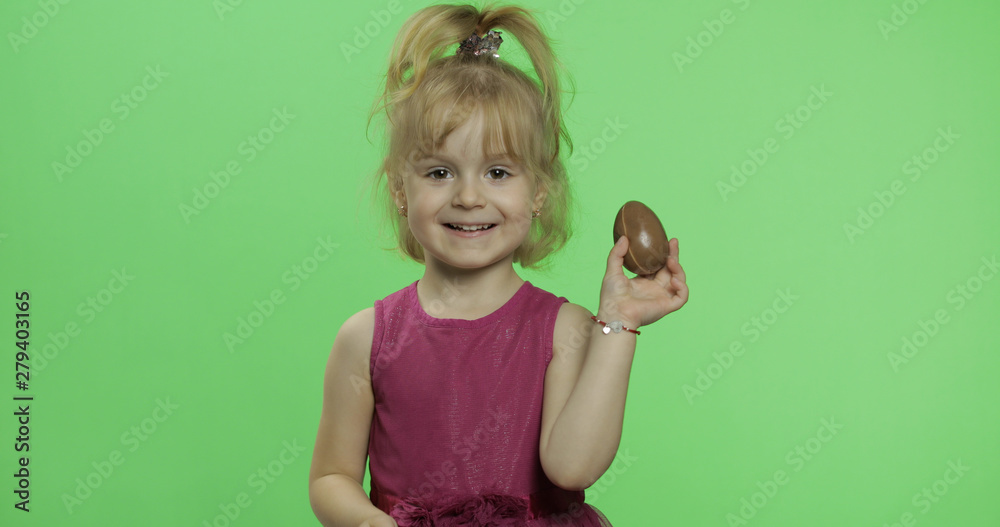 Girl in purple dress with chocolate egg. Happy four years old child. Chroma Key Girl in purple dress with chocolate egg. Happy four years old child. Chroma Key