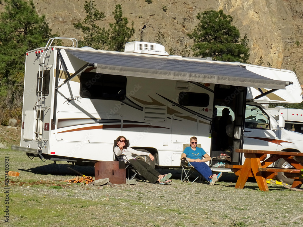 Campers relax at campsite in canada Campers relax at campsite in canada