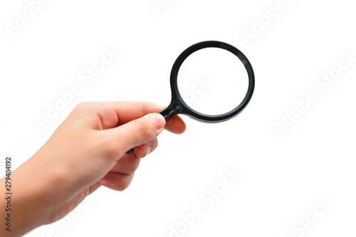 Hand holding magnifying glass