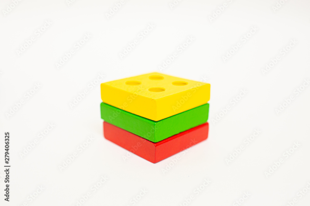 Obraz premium Toy wooden blocks, multicolor building construction bricks Lithuania flag. White background. Early education