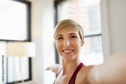 Trendy woman doing yoga as part of her mindfulness morning routine Free Download Trendy woman doing yoga as part of her mindfulness morning routine - GFXLoad