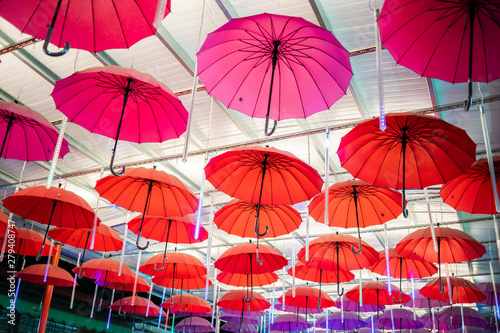 Multiple Colorful Umbrellas Hanging From The Roof photo