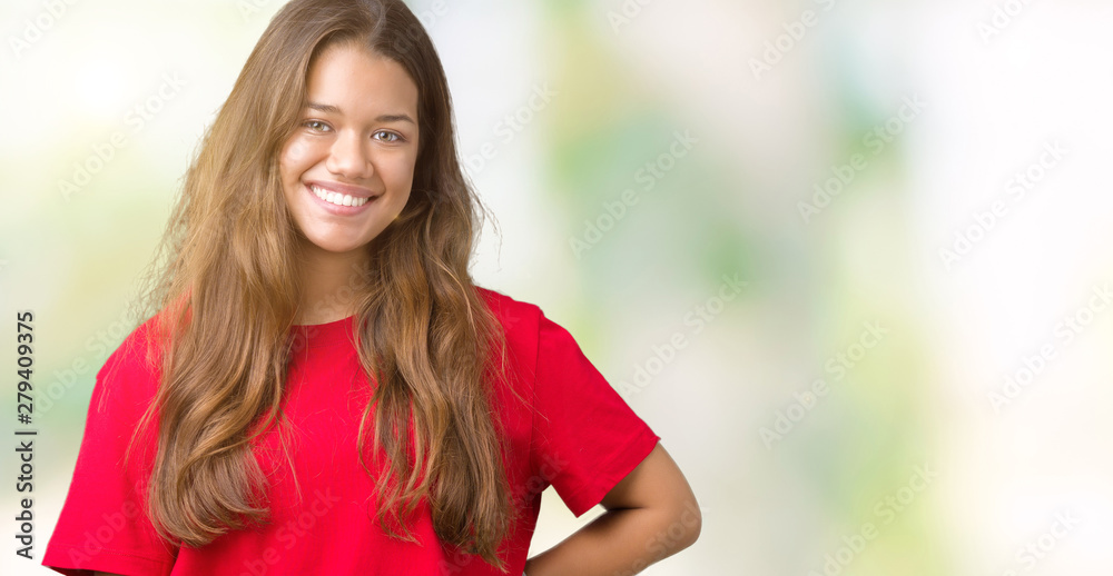 Young beautiful brunette woman wearing red t-shirt over isolated background with a happy and cool smile on face. Lucky person. Young beautiful brunette woman wearing red t-shirt over isolated background with a happy and cool smile on face. Lucky person.