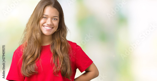 Young beautiful brunette woman wearing red t-shirt over isolated background with a happy and cool smile on face. Lucky person.