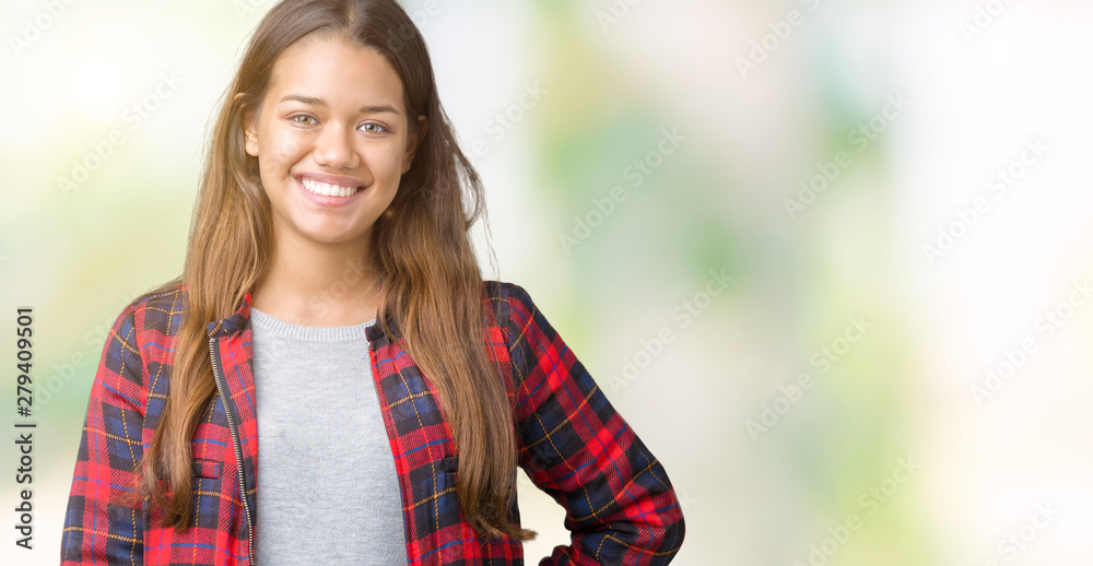 Young beautiful brunette woman wearing a jacket over isolated background with a happy and cool smile on face. Lucky person. Young beautiful brunette woman wearing a jacket over isolated background with a happy and cool smile on face. Lucky person.