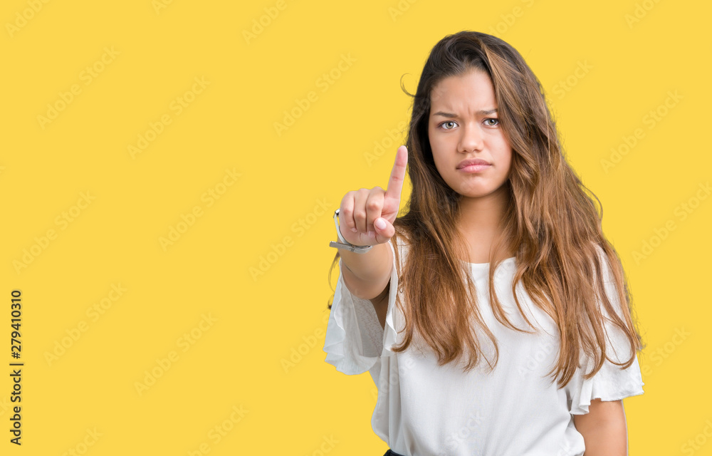 Young beautiful brunette business woman over isolated background Pointing with finger up and angry expression Young beautiful brunette business woman over isolated background Pointing with finger up and angry expression