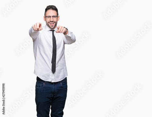 Young handsome business man wearing glasses over isolated background Pointing to you and the camera with fingers, smiling positive and cheerful