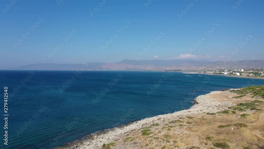 Aerial view over the coast at Polis Chrysochou and Lachi beach with mountains in the background Aerial view over the coast at Polis Chrysochou and Lachi beach with mountains in the background