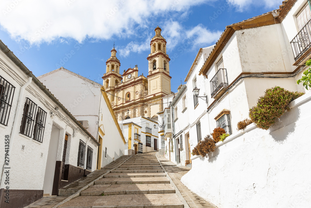 a street in Olvera town and Our Lady of the Incarnation church, province of Cadiz, Andalusia, Spain