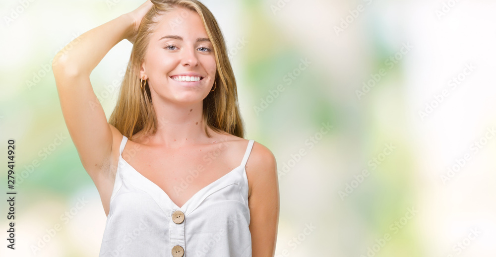 Beautiful young woman over isolated background Smiling confident touching hair with hand up gesture, posing attractive Beautiful young woman over isolated background Smiling confident touching hair with hand up gesture, posing attractive