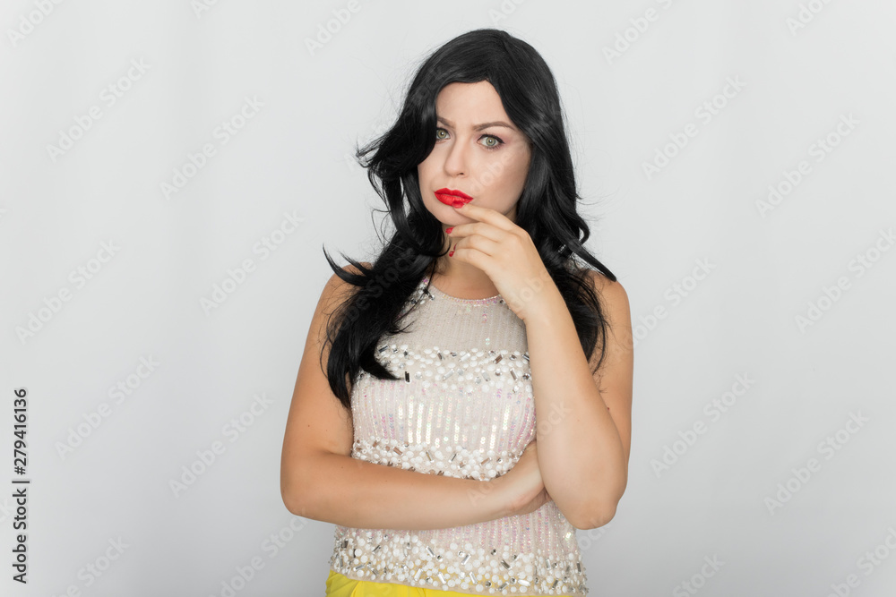 Portrait of a beautiful young brunette isolated on white background. Woman posing in the studio Portrait of a beautiful young brunette isolated on white background. Woman posing in the studio