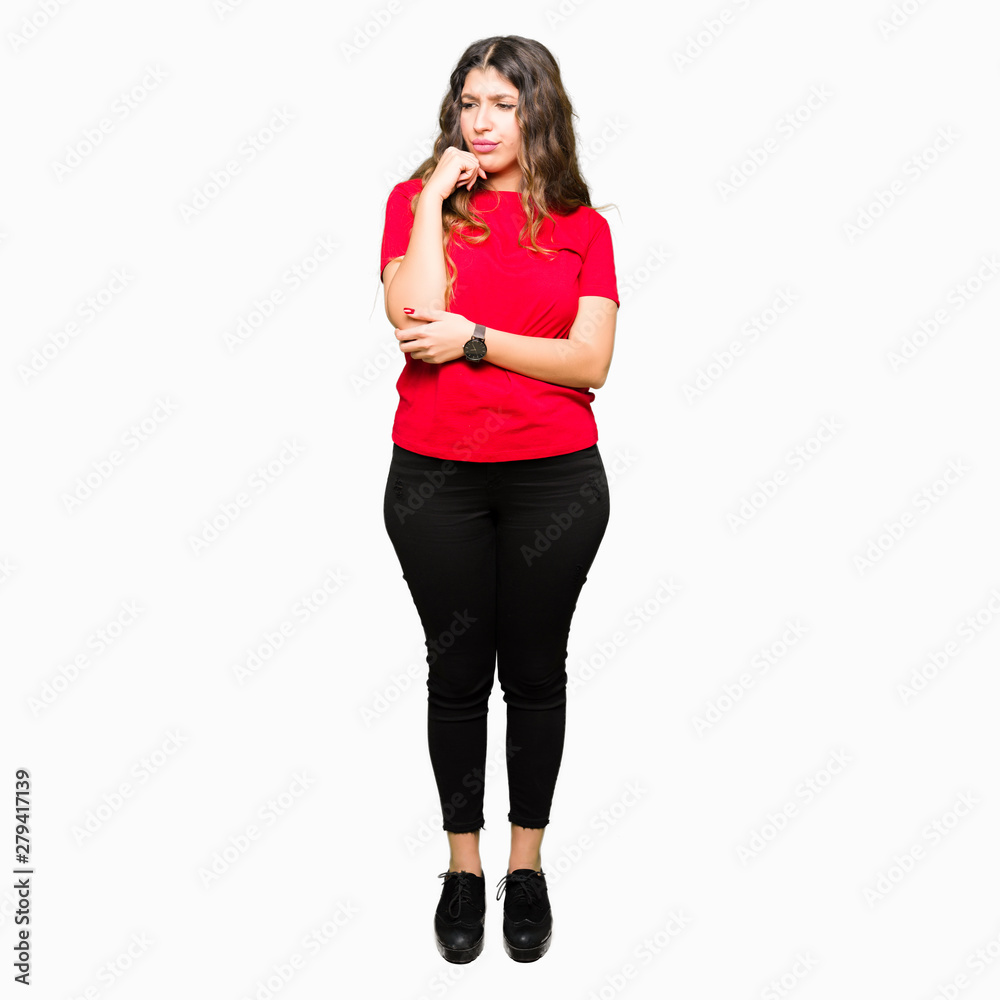 Young beautiful woman wearing casual t-shirt with hand on chin thinking about question, pensive expression. Smiling with thoughtful face. Doubt concept. Young beautiful woman wearing casual t-shirt with hand on chin thinking about question, pensive expression. Smiling with thoughtful face. Doubt concept.