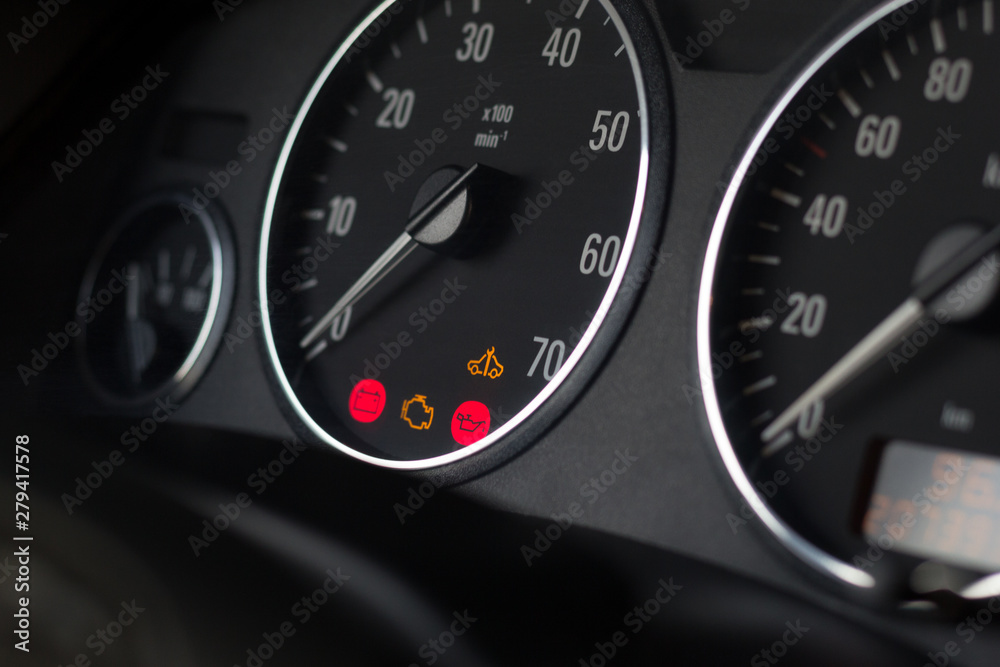 Dashboard indicators of usual car. Selective focus on tachometer. Dashboard indicators of usual car. Selective focus on tachometer.