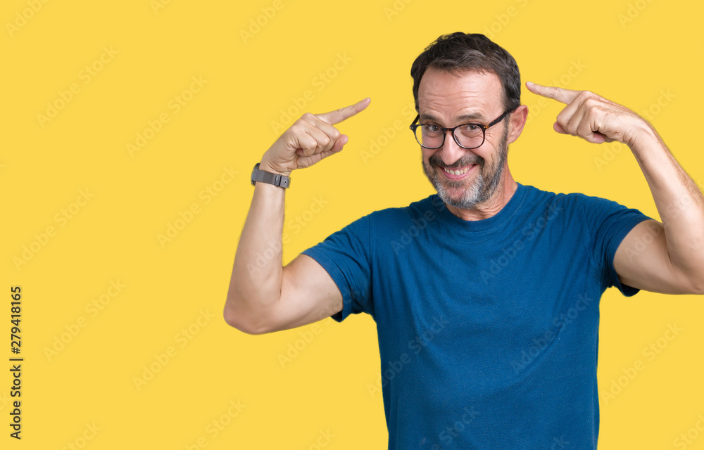 Handsome middle age hoary senior man wearin glasses over isolated background Smiling pointing to head with both hands finger, great idea or thought, good memory Handsome middle age hoary senior man wearin glasses over isolated background Smiling pointing to head with both hands finger, great idea or thought, good memory