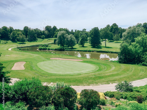 Photography Beautiful green landscape of Canadian Ontario country-side Alliston town with golf course and small lake pond on sunny day