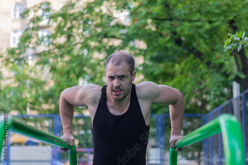 sport athlete doing exercise on uneven bars gym lifestyle fitness