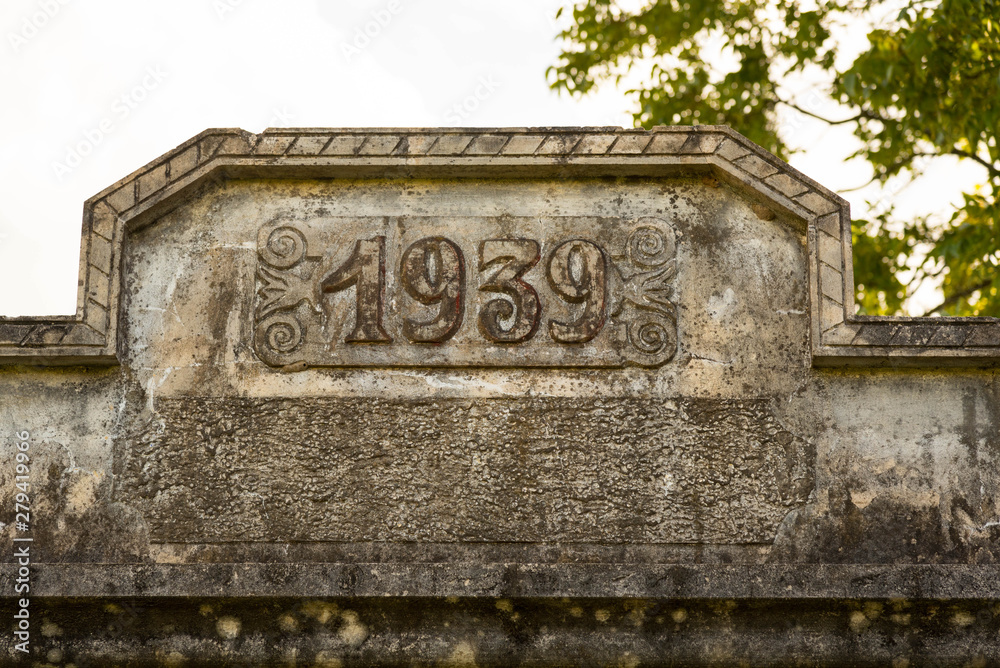 The date of construction on the façade of the old house