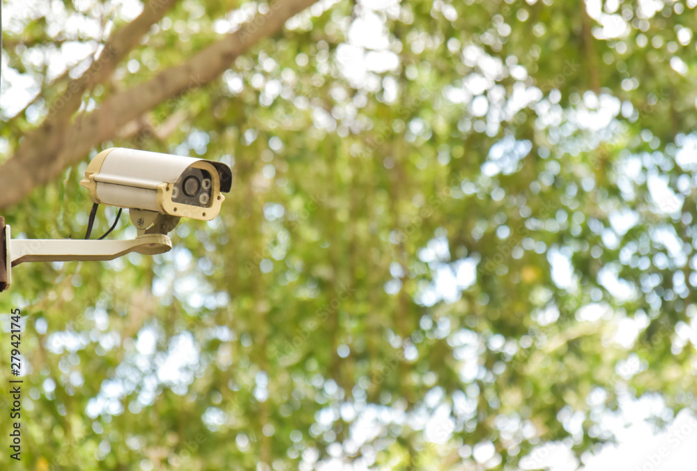 Closed circuit camera on the green bokeh background Closed circuit camera on the green bokeh background