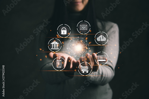 Digital marketing. Businesswoman holding global circle interface payment online shopping and icon customer network connection on virtual screen. Data exchanges. Business innovation technology concept