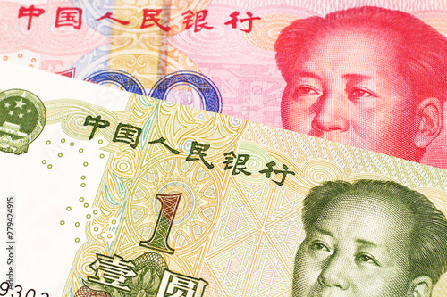 Wallpaper Mural A close up image of a one yuan note from the People's Republic of China along with a red, one hundred yuan note from China Torontodigital.ca