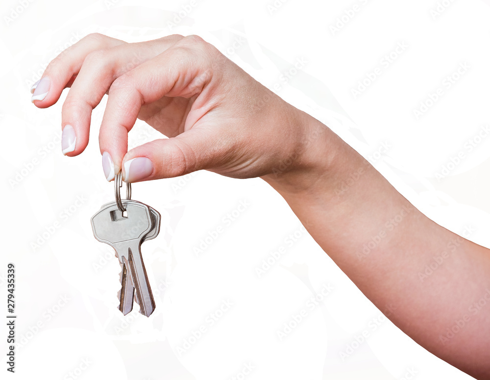 The girl holds the keys in her hand on a white isolated background_ The girl holds the keys in her hand on a white isolated background_