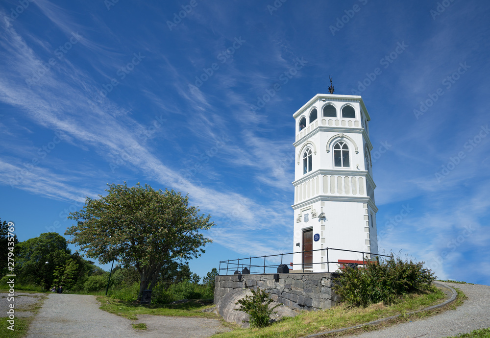 Varden viewpoint, the highest point on Kirkelandet. 360 degree view via arched windows of the shipping fairway, all of Kristiansund, the fjords, mountains. Green surrounding, bright day. Norway.