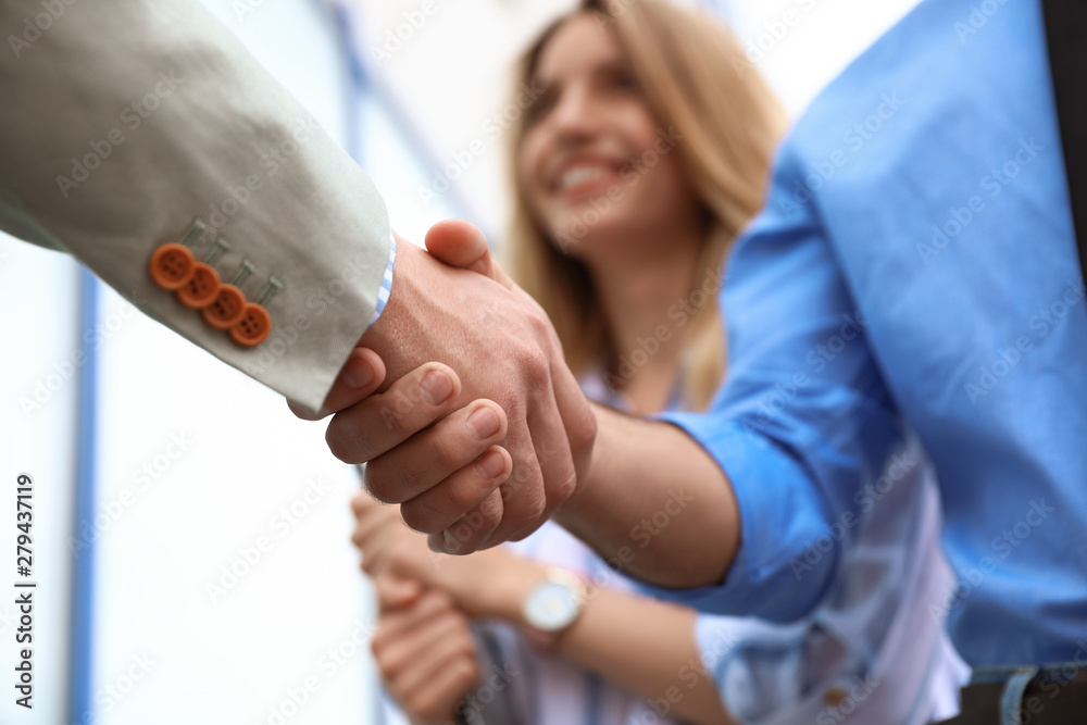 Business partners shaking hands after meeting, closeup - obrazy, fototapety, plakaty 