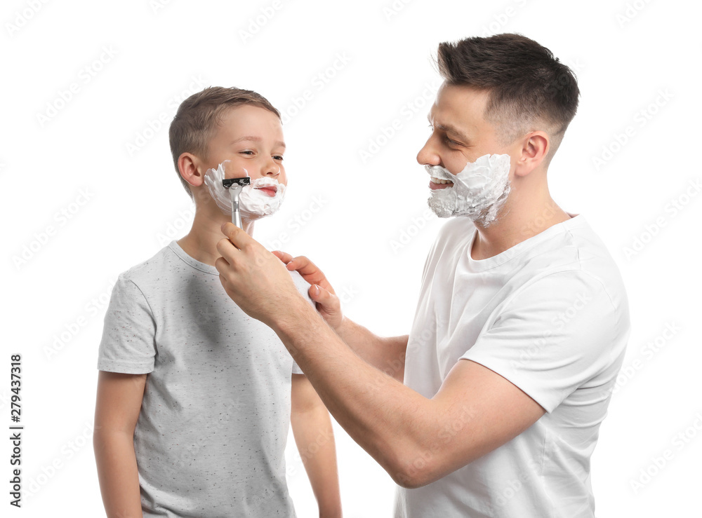 Dad pretending to shave his little son on white background