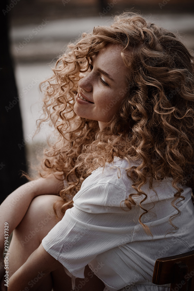 Beautiful curly girl in white lingerie. Outdoor photography Beautiful curly girl in white lingerie. Outdoor photography