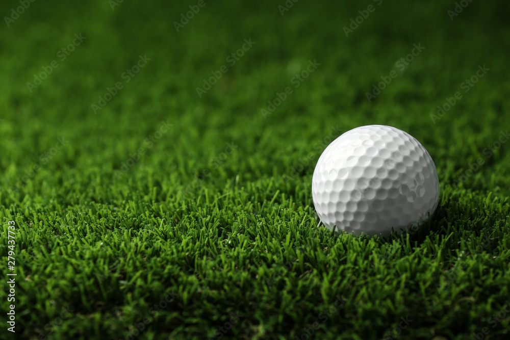 Golf ball on artificial grass, space for text Golf ball on artificial grass, space for text